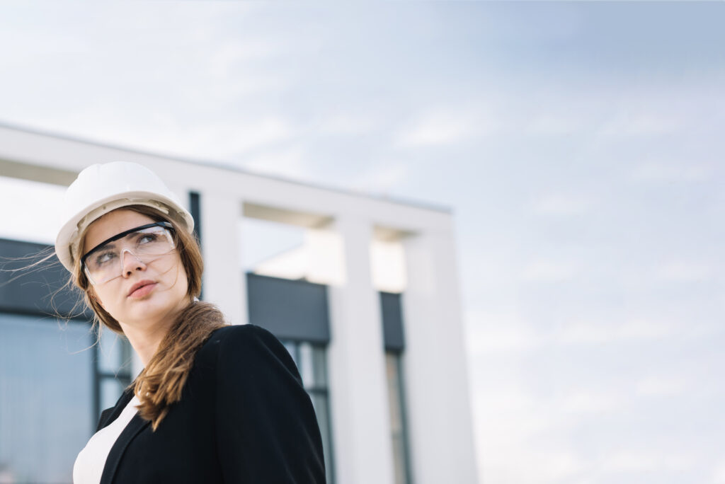 a woman in construction contemplates why women overapologize