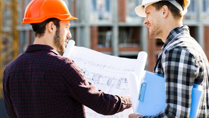 two men display how important communication in construction is